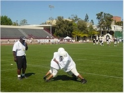 Former NFL player Riki Ellison helps at-risk youngsters through his youth football camps