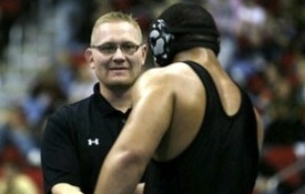 Jason Christianson, left, is the wrestling coach at Iowa powerhouse South East Polk High School