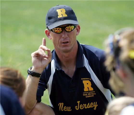 Coach Jim Freeman makes defense a focal point of his softball drills. 