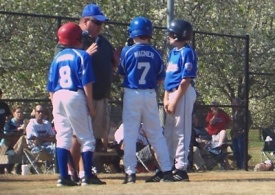 Little League baseball manager Randy Morris starts teaching signs to youth baseball players who are 9 or 10