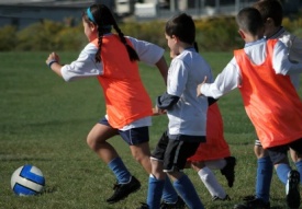 Teaching youth soccer players to spread out is a challenge for coaches